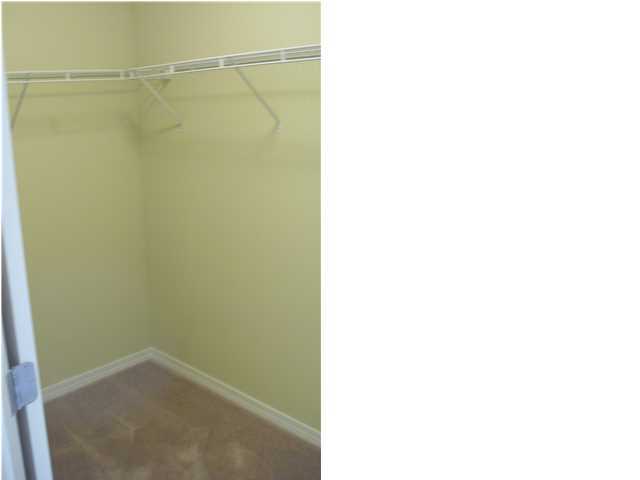 9685 Misty Meadow Lane Navarre, FL 32566 - Photo 14 of 18 a picture of a bathroom with a shower