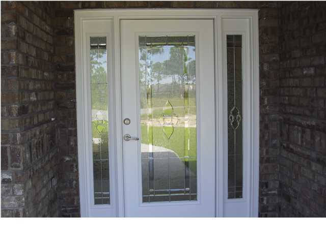 9685 Misty Meadow Lane Navarre, FL 32566 - Photo 2 of 18 a black and white photo of a balcony