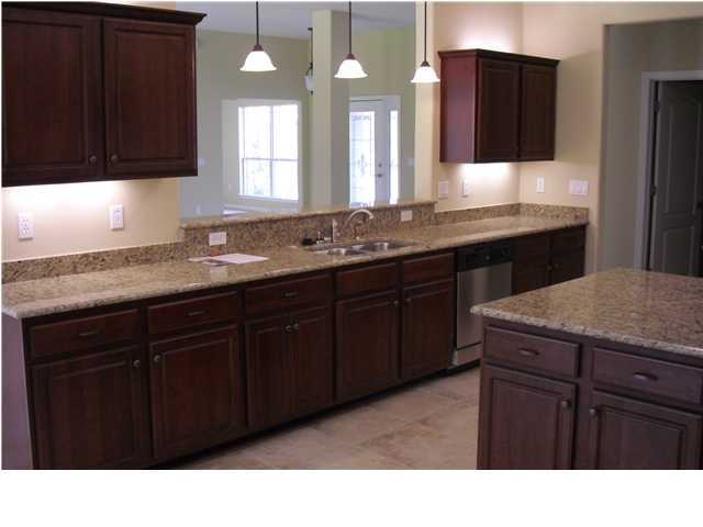 9685 Misty Meadow Lane Navarre, FL 32566 - Photo 4 of 18 a bathroom with a sink a vanity and a large mirror