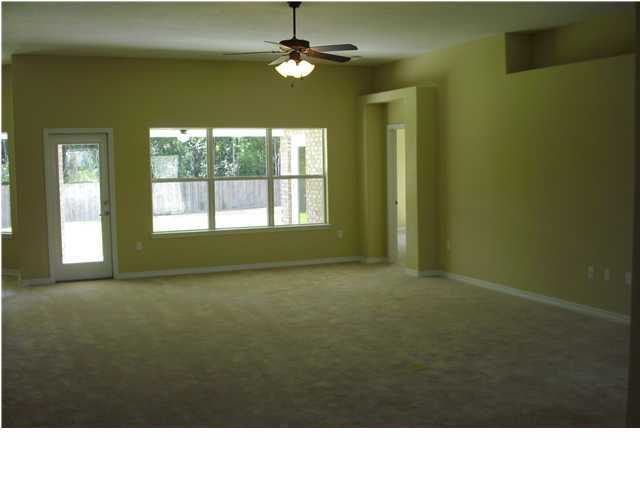 9685 Misty Meadow Lane Navarre, FL 32566 - Photo 10 of 18 a room with a window and ceiling fan