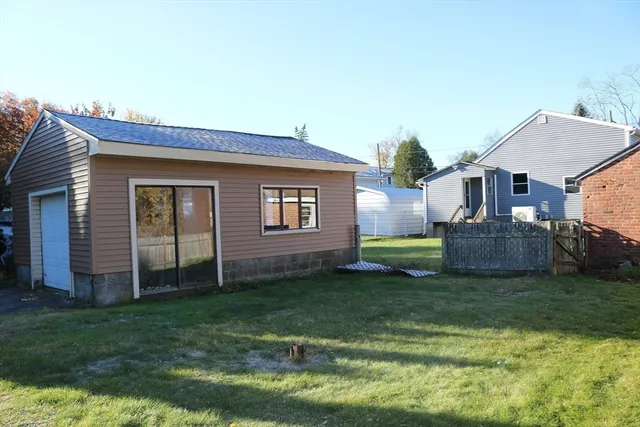 a view of a house with a yard