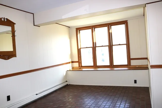 a view of a room with a large window