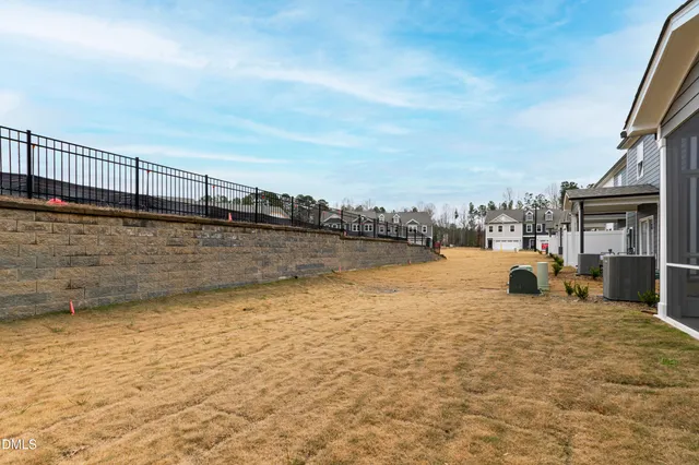 a view of swimming pool with lake and mountain in the back