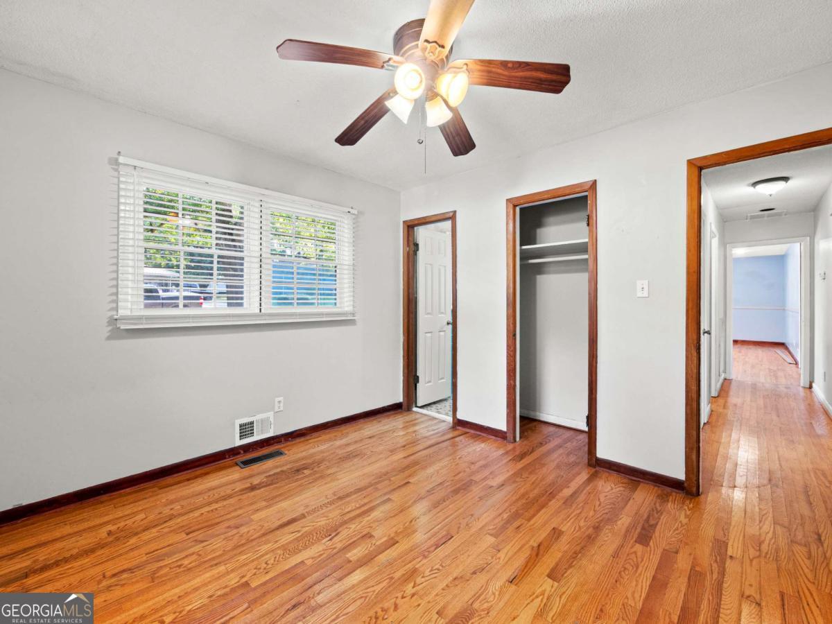 372 Hilltop Way Toccoa, GA 30577 - Photo 17 of 38 a view of an empty room with wooden floor and a window