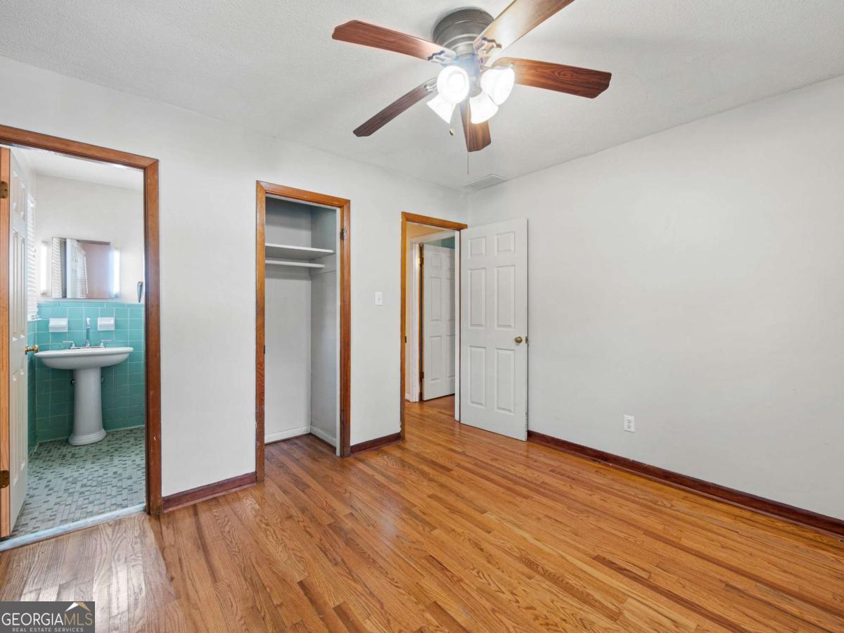 372 Hilltop Way Toccoa, GA 30577 - Photo 18 of 38 wooden floor in an empty room with a window