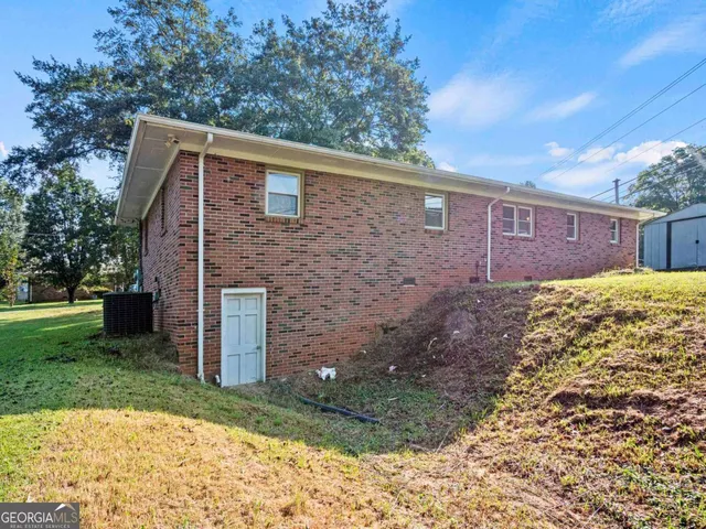 a brick house with a yard