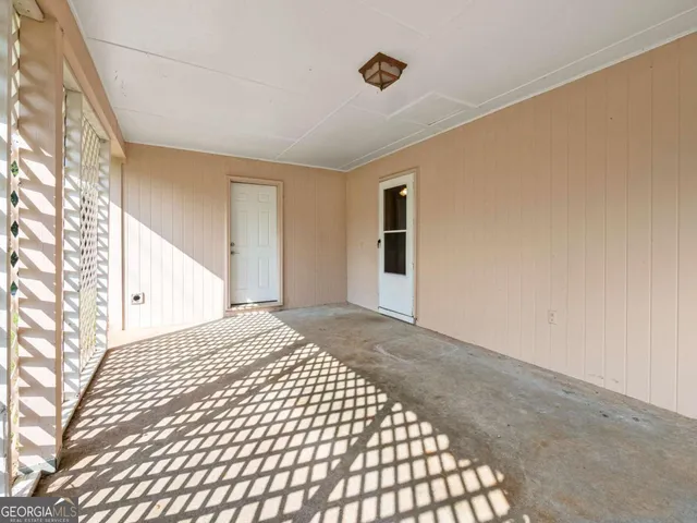 an aerial view of a residential houses with yard and swimming pool