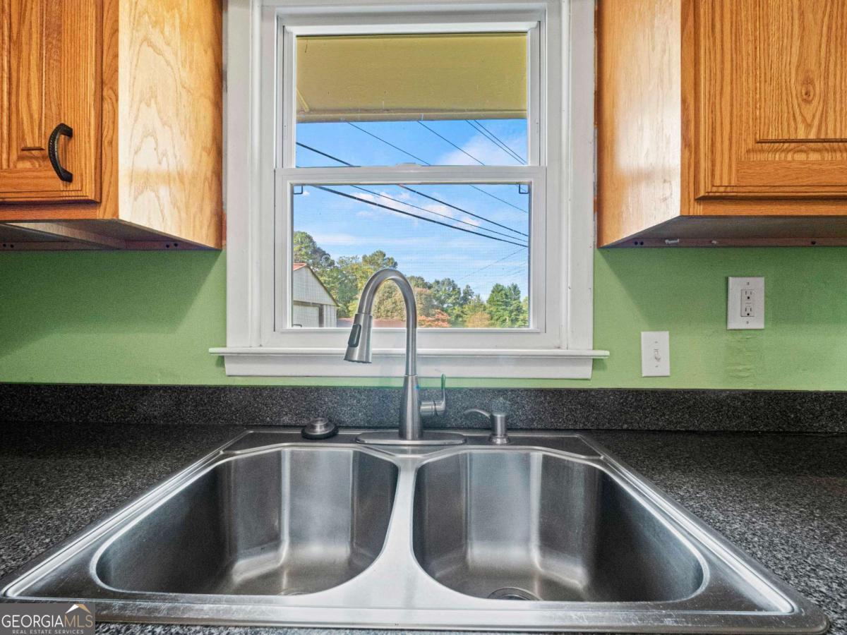 372 Hilltop Way Toccoa, GA 30577 - Photo 10 of 38 a kitchen with a sink and a window