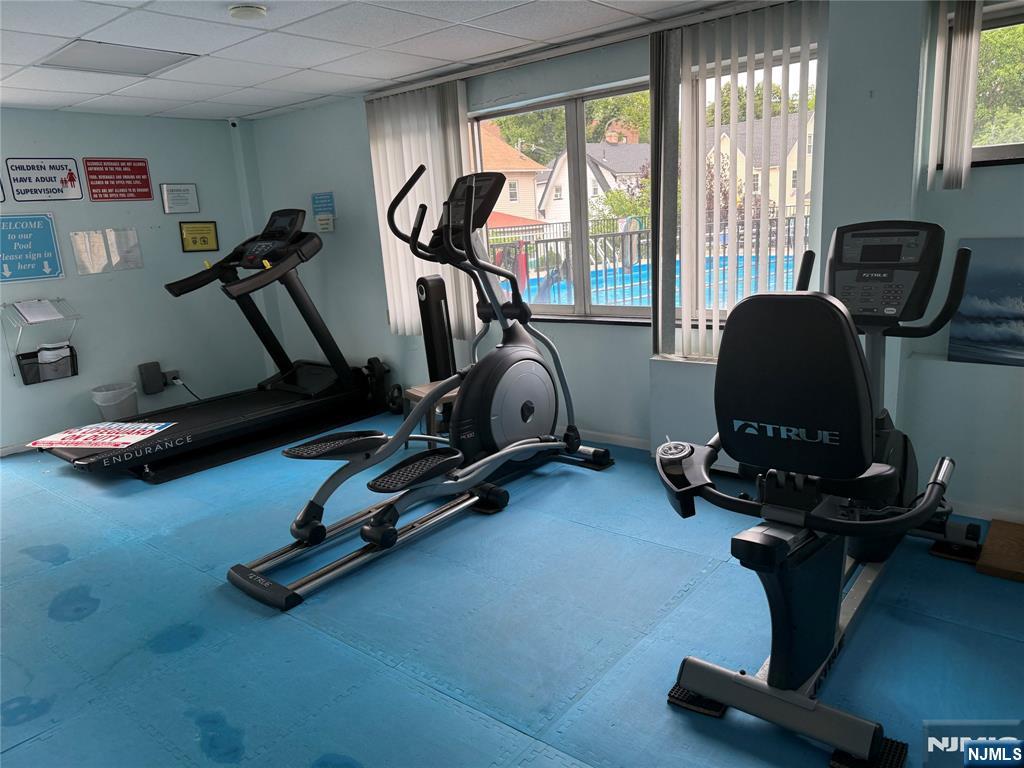 265 Main Street, Unit 702 Ridgefield Park, NJ 07660 - Photo 8 of 20 a room with gym equipment and windows