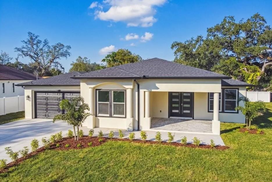 a front view of a house with a yard