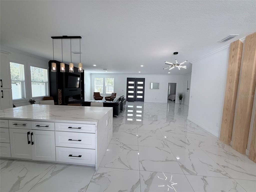 7403 Edgemere Road Tampa, FL 33625 - Photo 12 of 41 a kitchen with cabinets and window