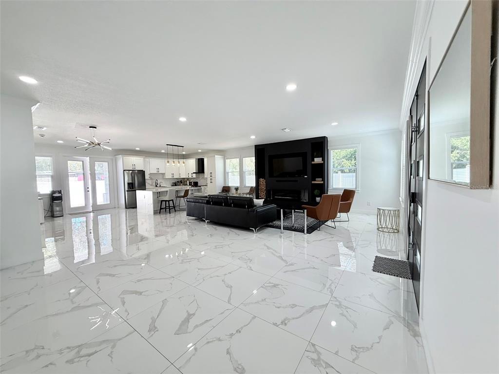 7403 Edgemere Road Tampa, FL 33625 - Photo 16 of 41 a living room with furniture and a flat screen tv