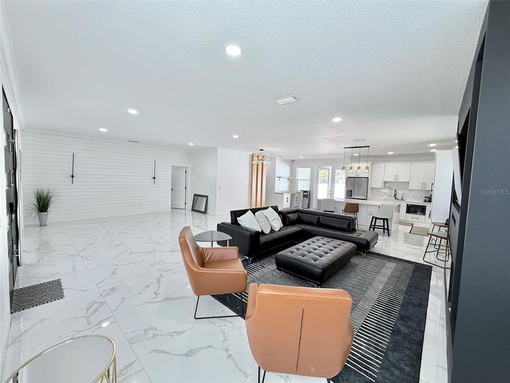 7403 Edgemere Road Tampa, FL 33625 - Photo 17 of 41 a living room with furniture and a couch