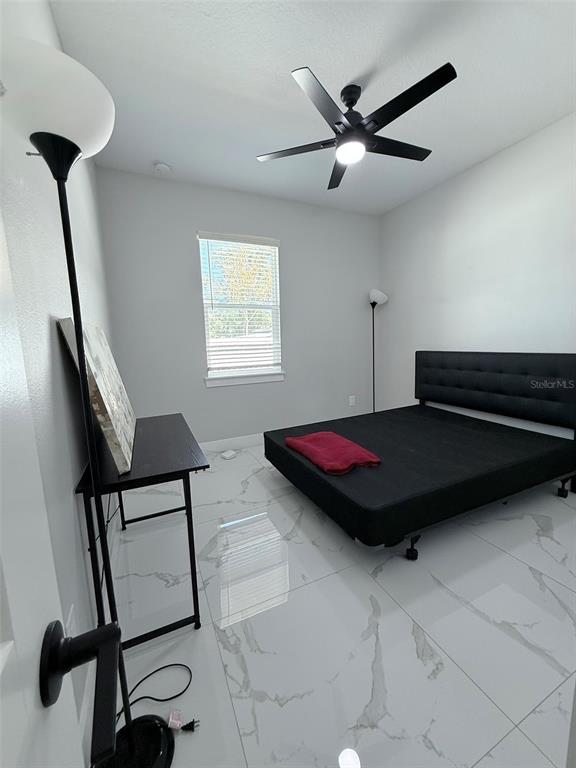 7403 Edgemere Road Tampa, FL 33625 - Photo 28 of 41 a living room with furniture and a window