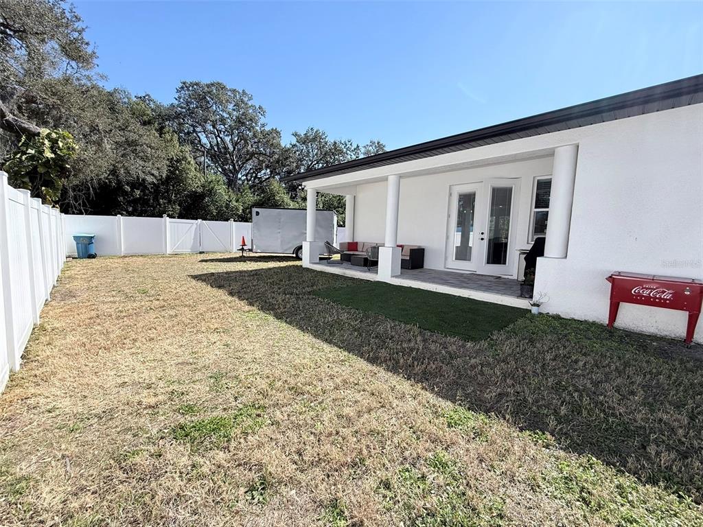 7403 Edgemere Road Tampa, FL 33625 - Photo 33 of 41 a view of a house with backyard and trees