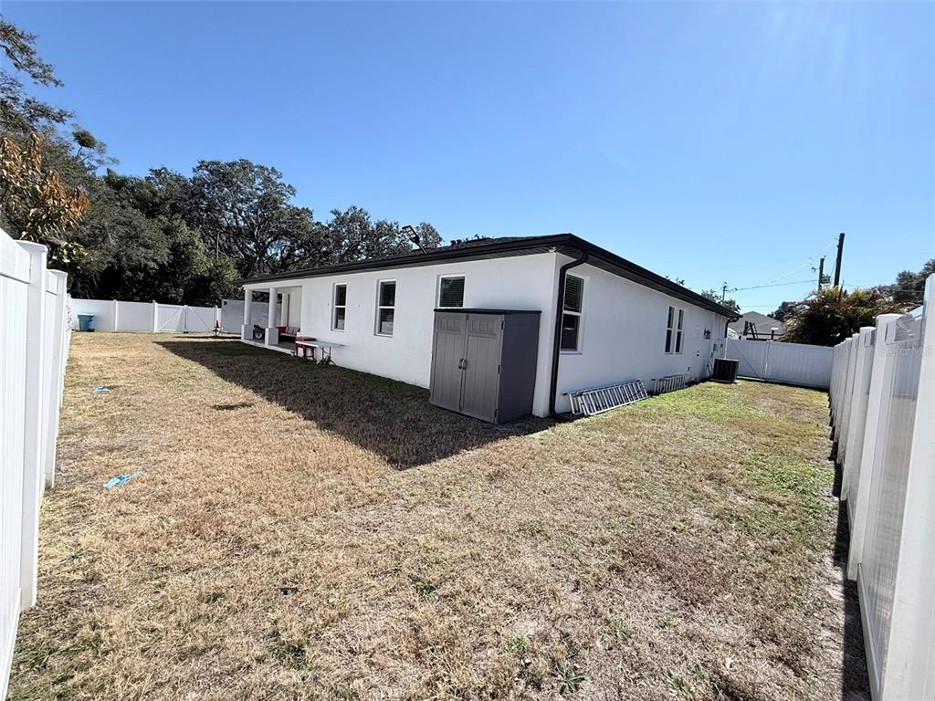 7403 Edgemere Road Tampa, FL 33625 - Photo 34 of 41 a view of a house with wooden fence