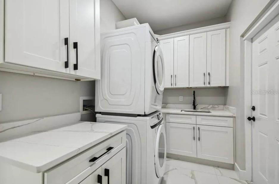 7403 Edgemere Road Tampa, FL 33625 - Photo 36 of 41 a room with dryer and washer