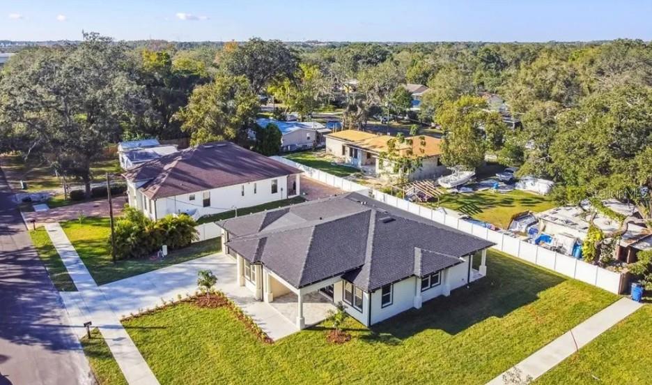 7403 Edgemere Road Tampa, FL 33625 - Photo 41 of 41 a view of a swimming pool with a patio