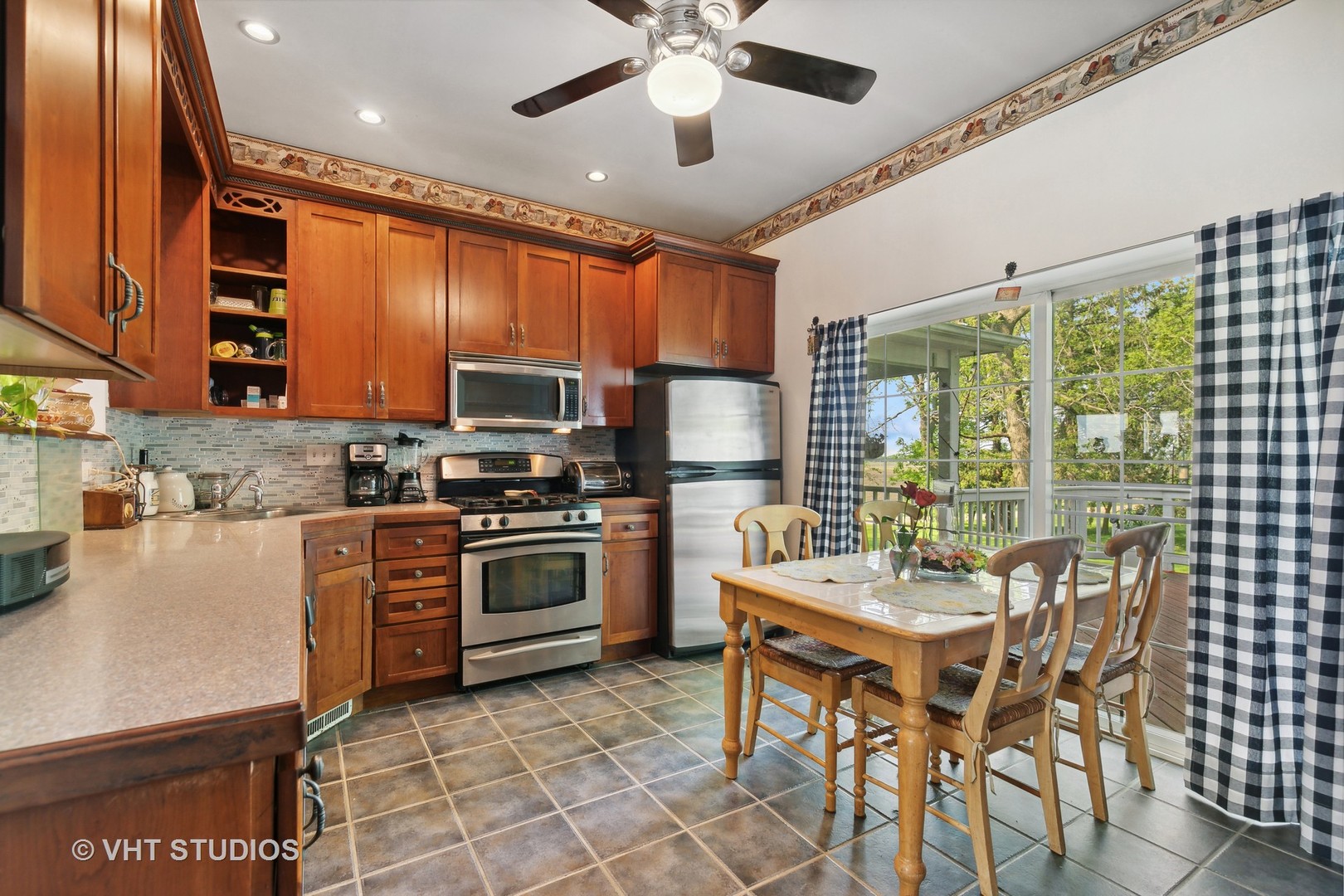 45W740 Read Road Maple Park, IL 60151 - Photo 13 of 26 a kitchen with a dining table chairs stainless steel appliances and cabinets