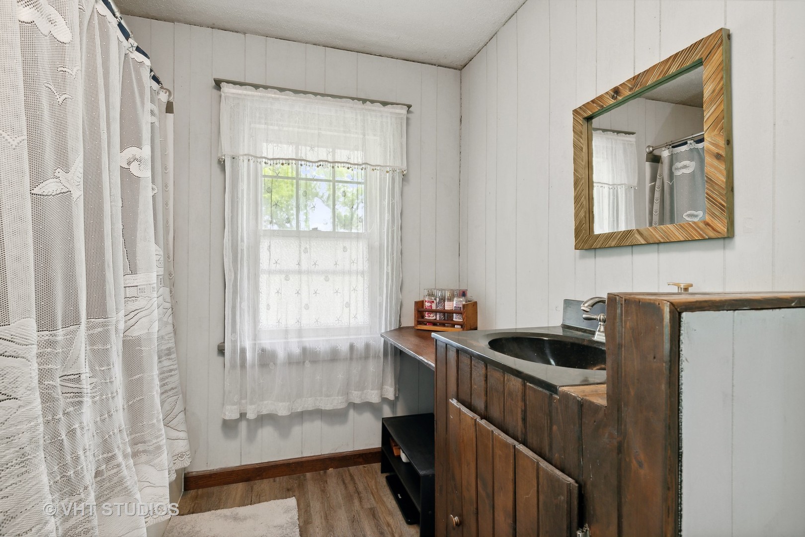 45W740 Read Road Maple Park, IL 60151 - Photo 19 of 26 a bathroom with a sink a mirror and a shower