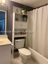 a bathroom with a toilet and a sink