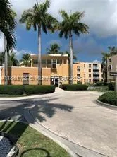 a front view of a house with a yard and a garage