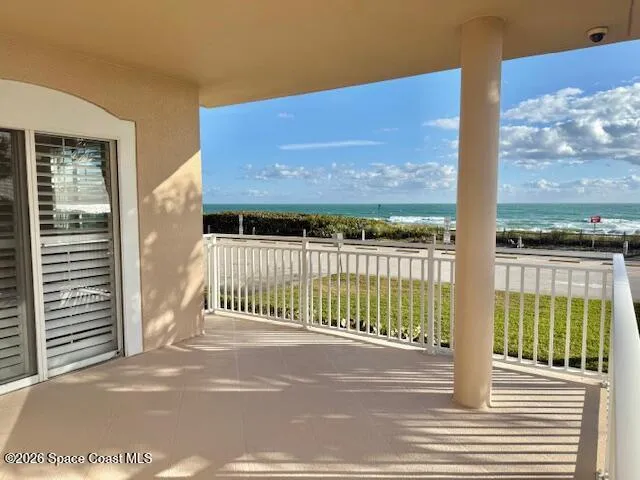 a view of a brick house with a street from a balcony