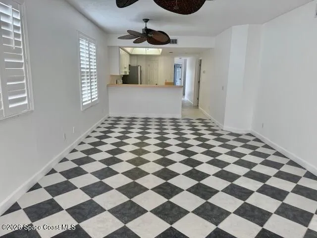 a view of a interior of the house and a checkered floor