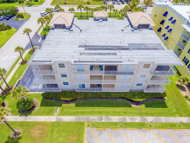 a view of a swimming pool with a yard