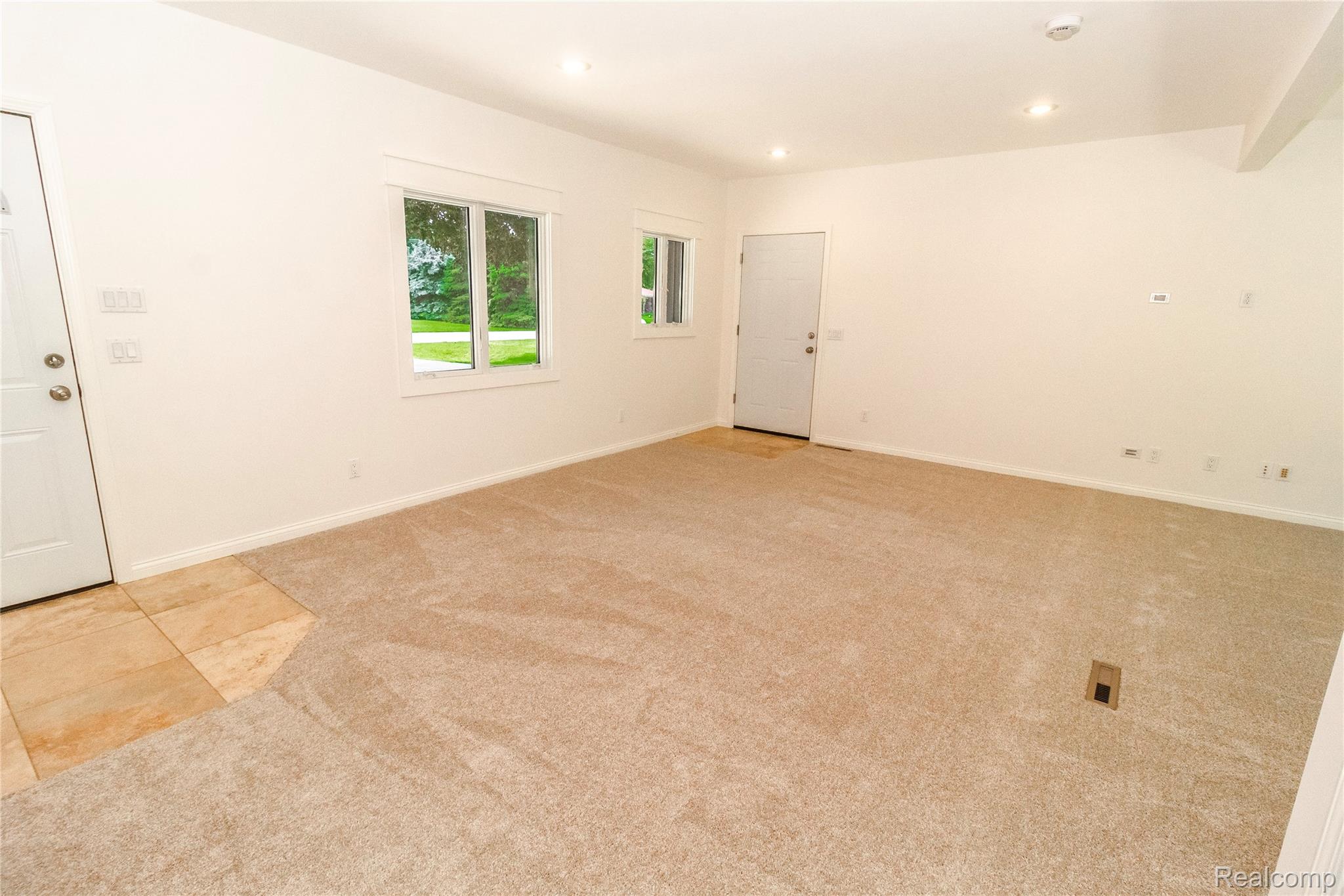 1138 Baldwin Road Lapeer, MI 48446 - Photo 9 of 49 Spacious interior with neutral carpeting and a tiled entry