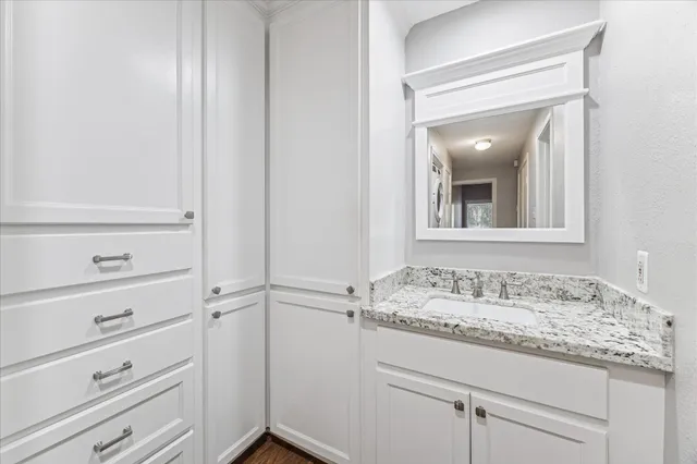 a bathroom with a sink and vanity