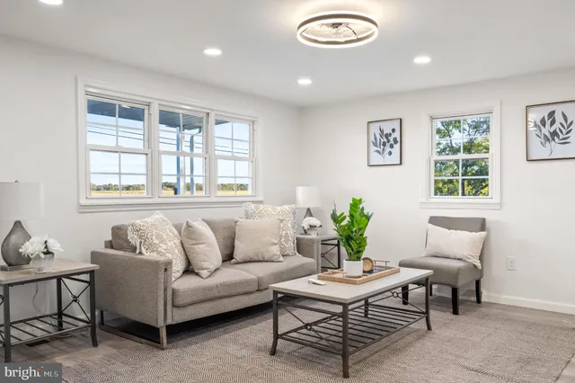 a living room with furniture and windows