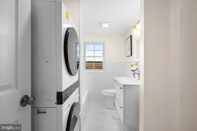 a bathroom with a sink toilet and a mirror