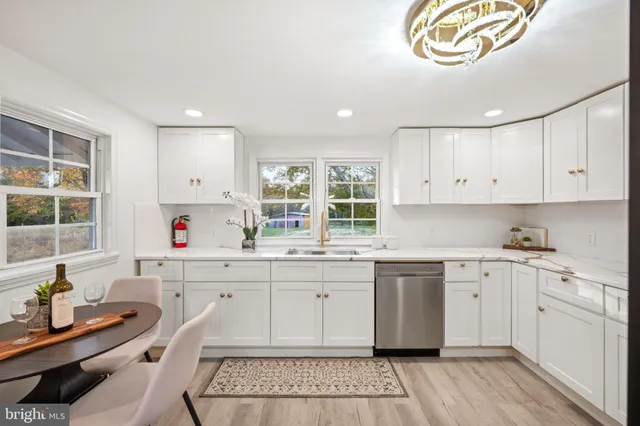 a kitchen with a sink cabinets and window