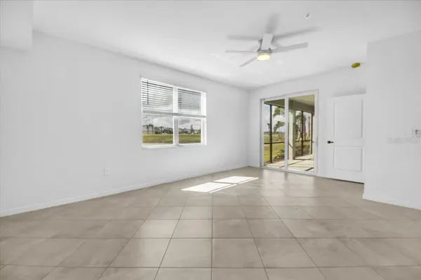 a view of an empty room with a window