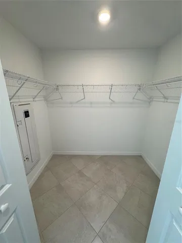 a bathroom with a bathtub sink and mirror