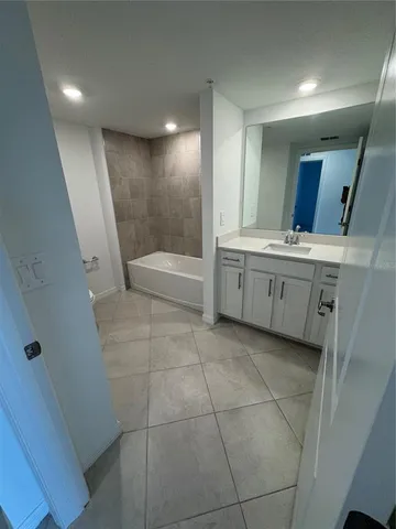 a bathroom with a toilet and a bathtub
