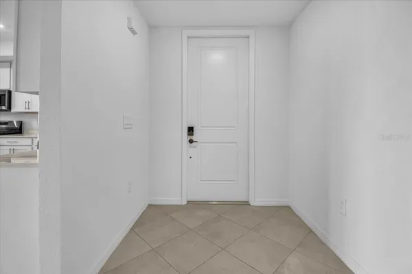 a view of an empty room with a window