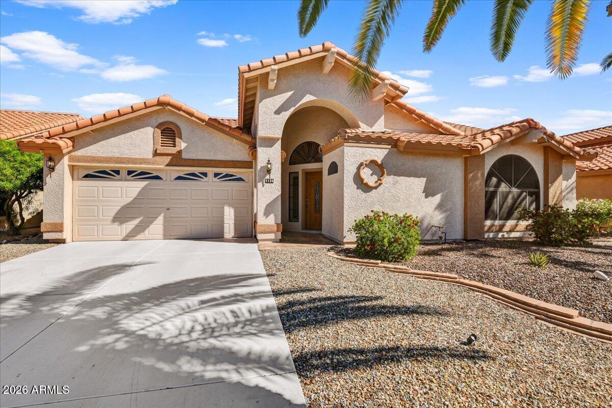 9136 West Rimrock Drive Peoria, AZ 85382 - Photo 1 of 25 a front view of a house