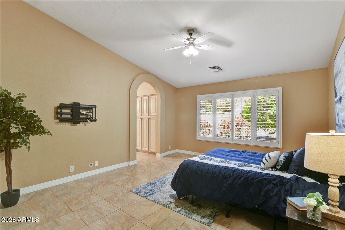 9136 West Rimrock Drive Peoria, AZ 85382 - Photo 12 of 25 a spacious bedroom with a bed and a window