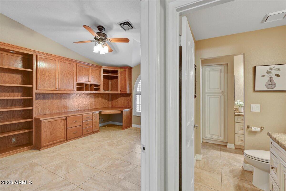 9136 West Rimrock Drive Peoria, AZ 85382 - Photo 17 of 25 a kitchen with stainless steel appliances a stove top oven and cabinets