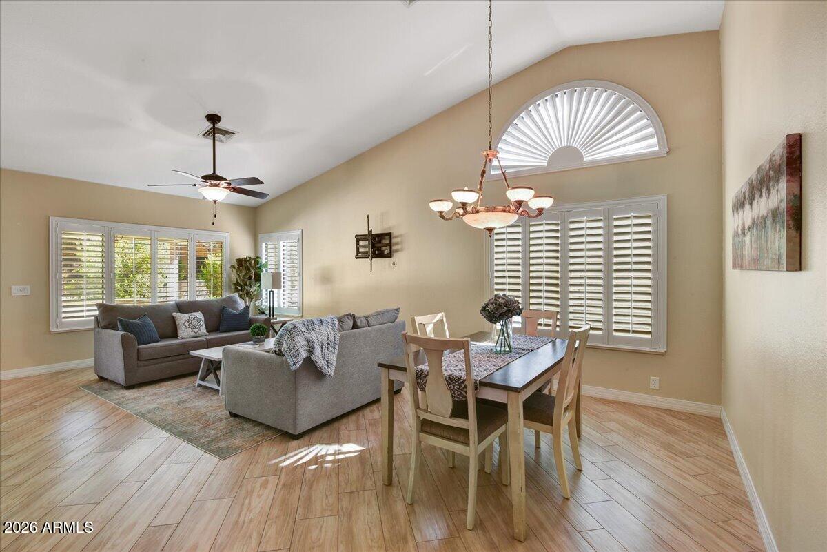 9136 West Rimrock Drive Peoria, AZ 85382 - Photo 2 of 25 a view of a livingroom with furniture and wooden floor
