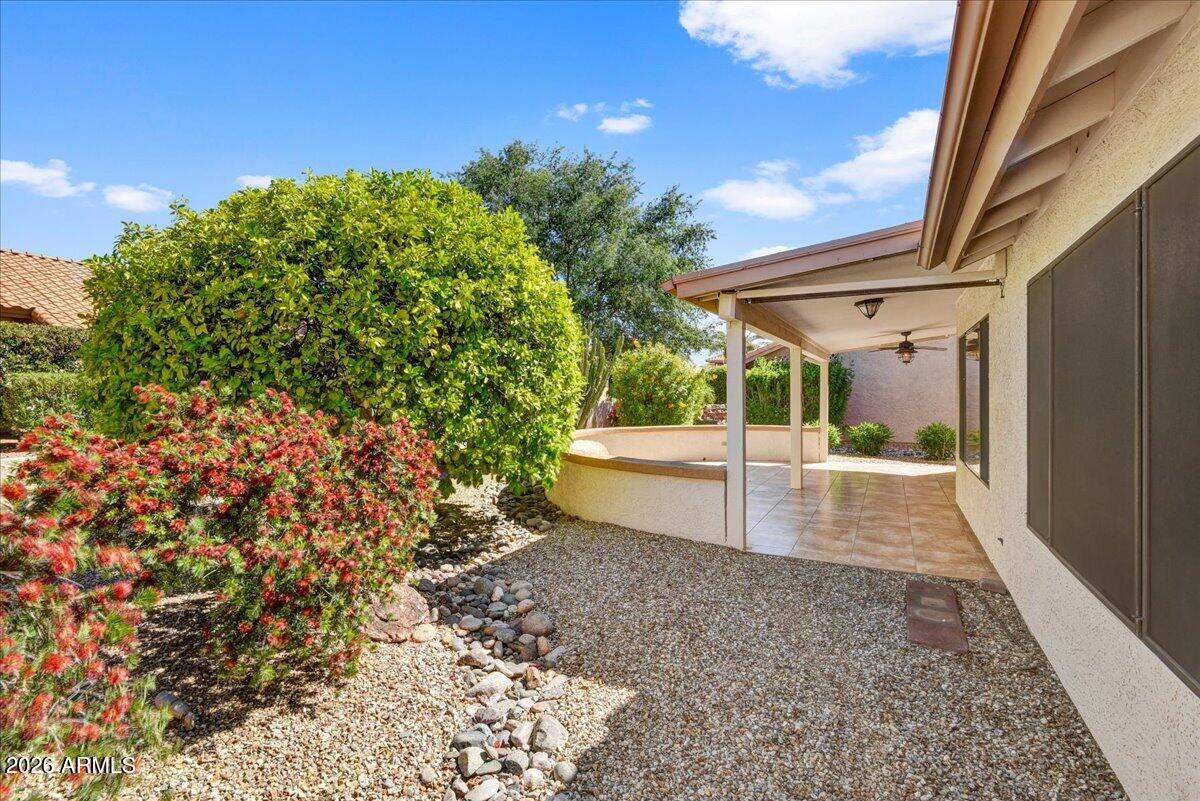 9136 West Rimrock Drive Peoria, AZ 85382 - Photo 24 of 25 a view of a patio with table and chairs and floor to ceiling window