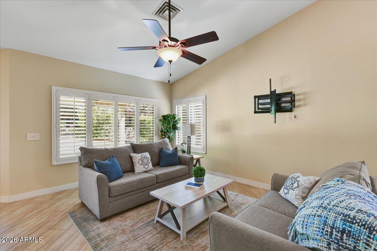 9136 West Rimrock Drive Peoria, AZ 85382 - Photo 3 of 25 a living room with furniture and a window