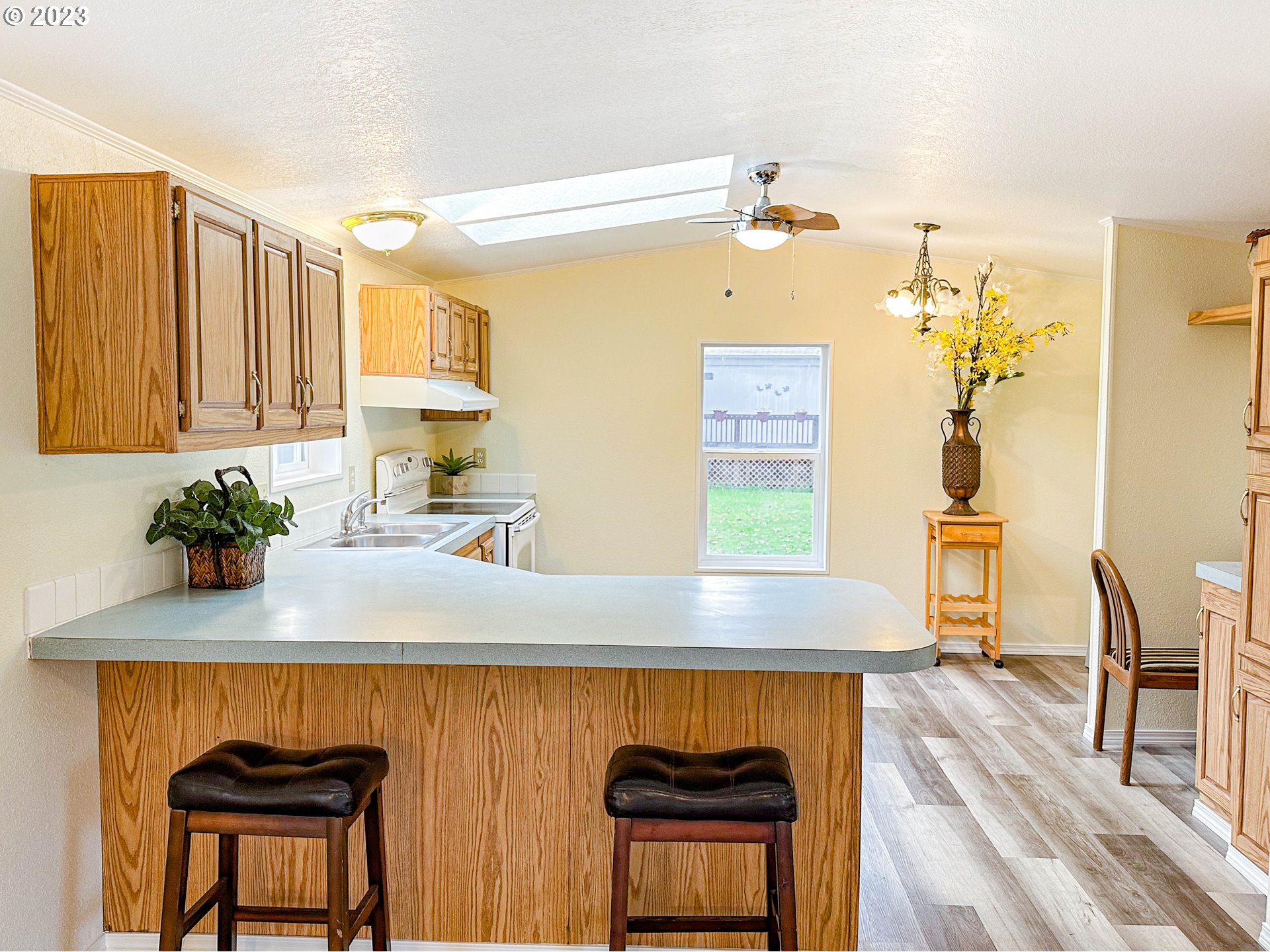 4475 Franklin Boulevard, Unit 13 Eugene, OR 97403 - Photo 6 of 22 a kitchen with a table chairs sink and cabinets