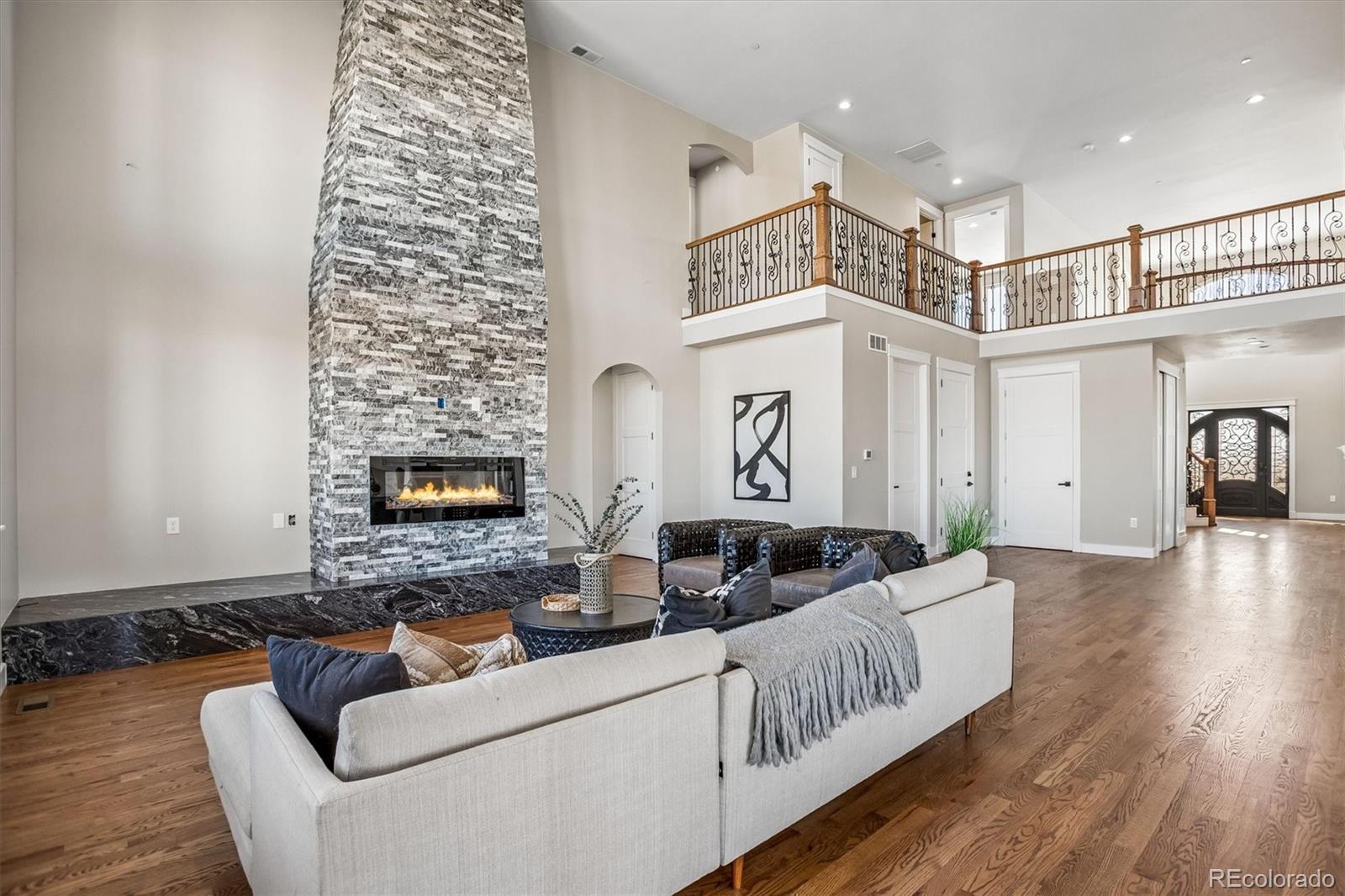 13350 Imboden Road Hudson, CO 80642 - Photo 11 of 50 a living room with furniture and a fireplace