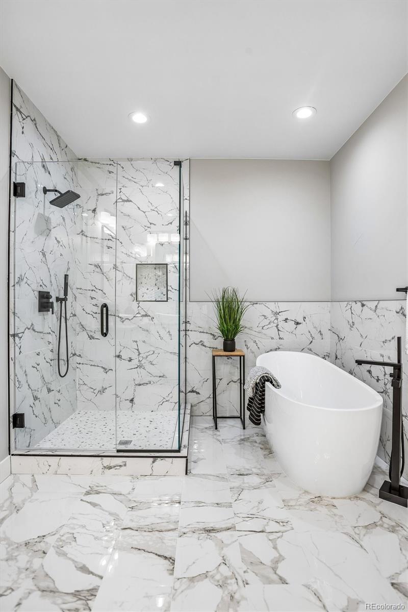 13350 Imboden Road Hudson, CO 80642 - Photo 21 of 50 a bathroom with a bathtub and shower