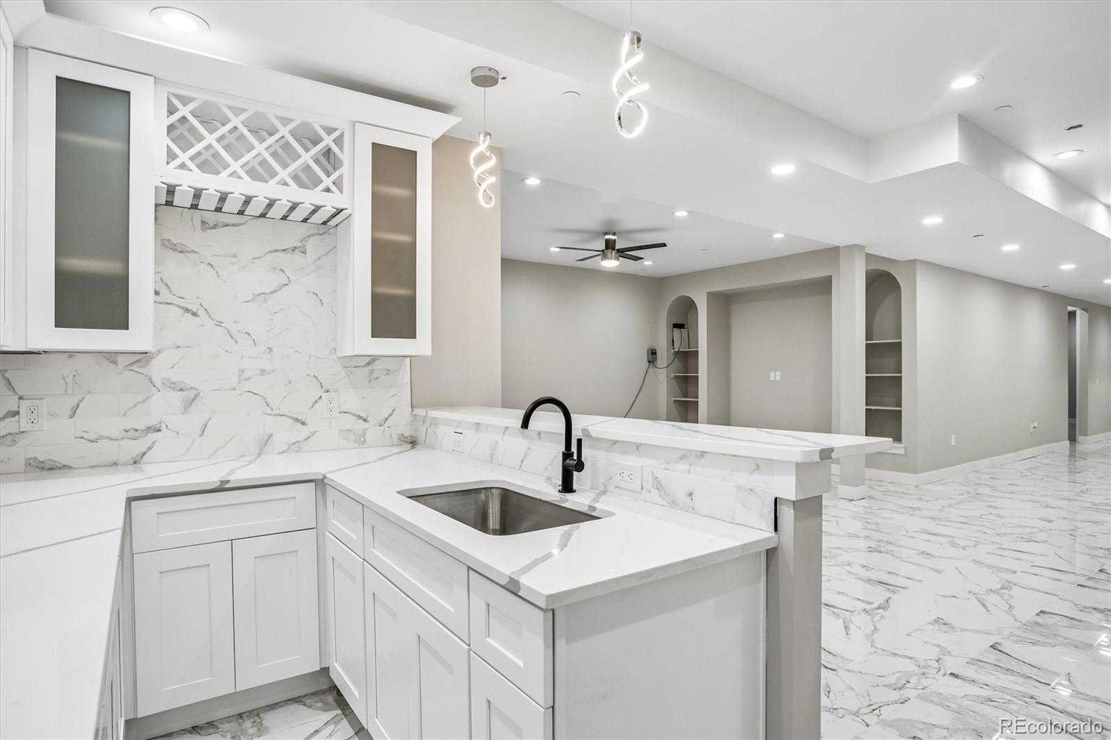 13350 Imboden Road Hudson, CO 80642 - Photo 36 of 50 a kitchen with a sink and a refrigerator
