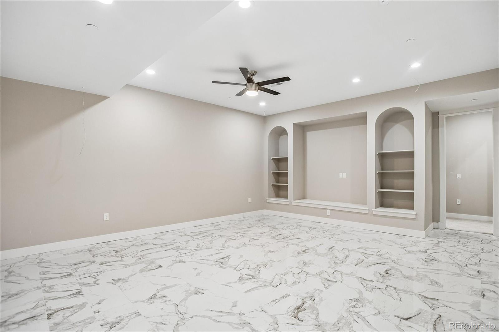 13350 Imboden Road Hudson, CO 80642 - Photo 38 of 50 a view of a livingroom with a ceiling fan and window