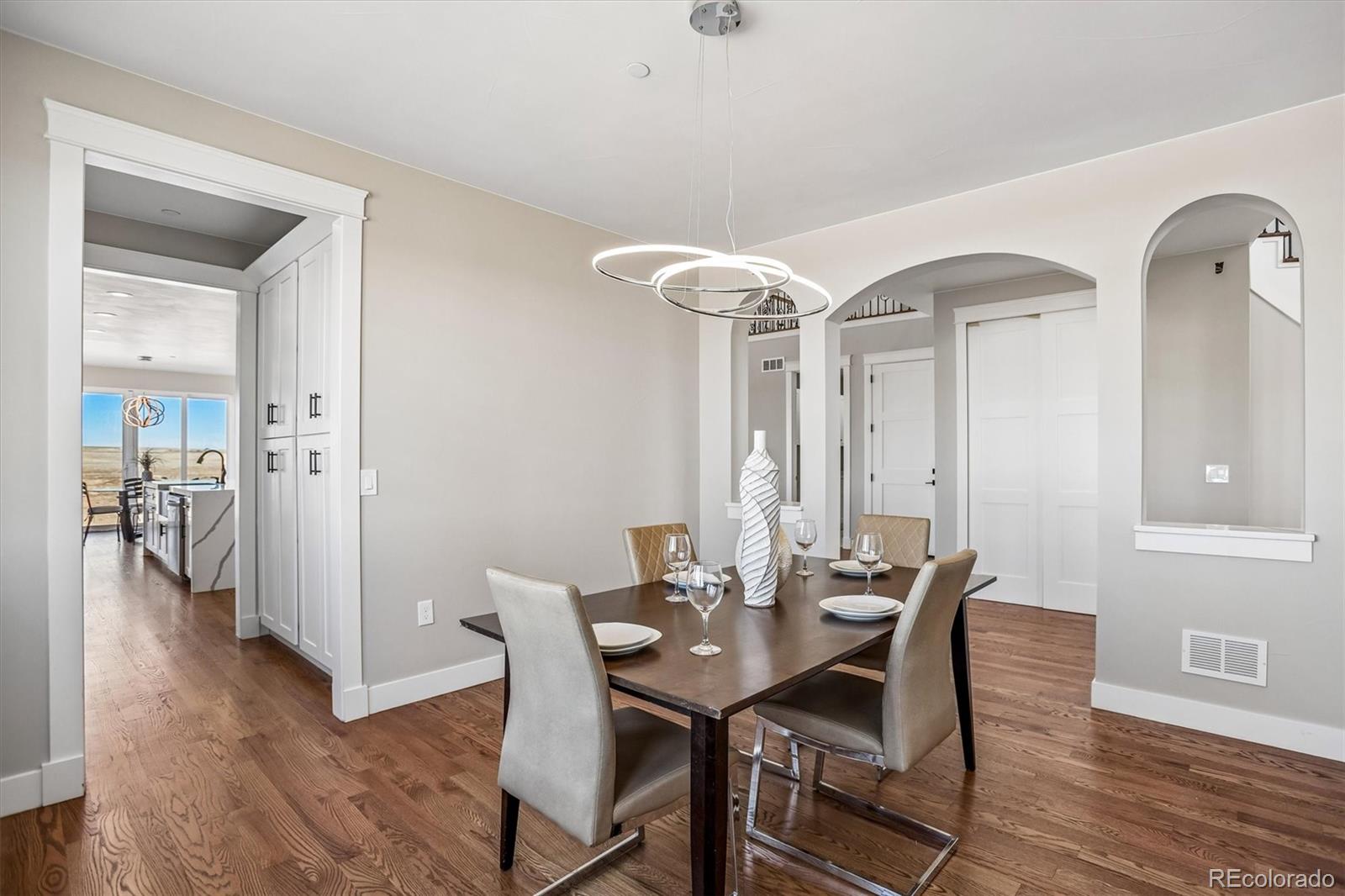 13350 Imboden Road Hudson, CO 80642 - Photo 5 of 50 a view of a dining room with furniture and wooden floor